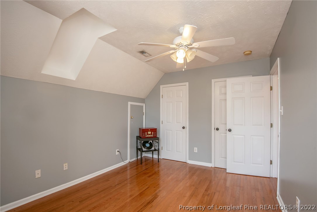 3577 Hayfield Road Wade, NC 28395 - Photo 30 of 47 an empty room with wooden floor and fan