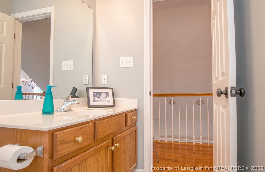 3577 Hayfield Road Wade, NC 28395 - Photo 32 of 47 a bathroom with a sink and a mirror