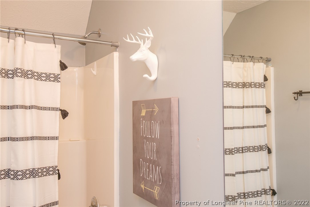 3577 Hayfield Road Wade, NC 28395 - Photo 33 of 47 a bathroom with a shower