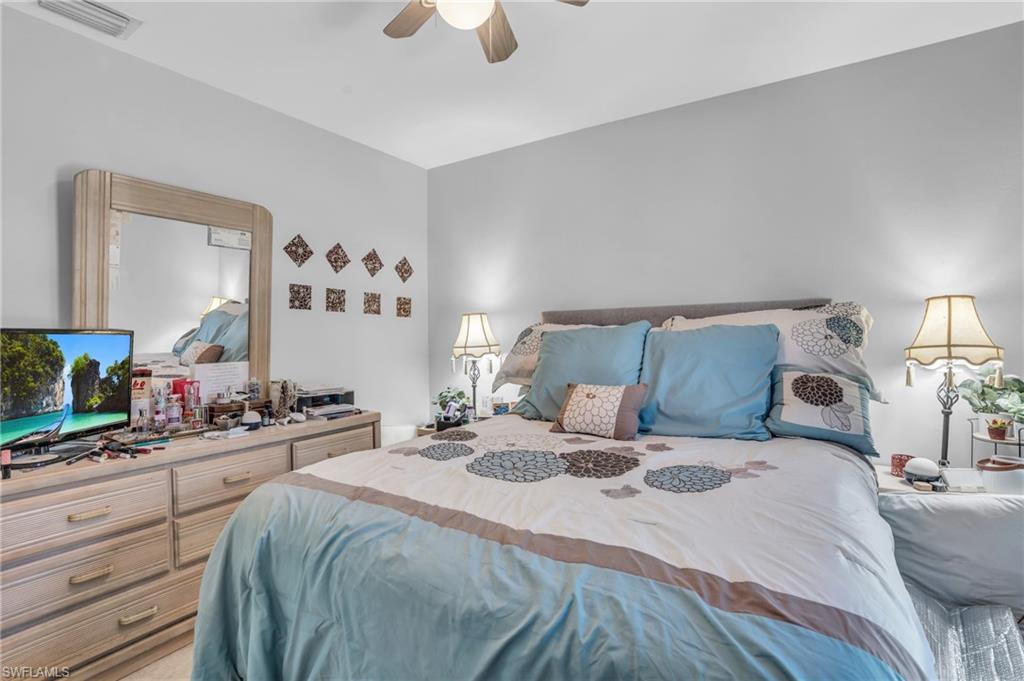 8069 Albatross Road Fort Myers, FL 33967 - Photo 11 of 21 Bedroom featuring ceiling fan