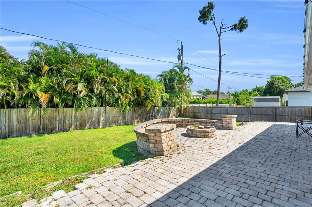 8069 Albatross Road Fort Myers, FL 33967 - Photo 18 of 21 View of patio / terrace featuring a fire pit