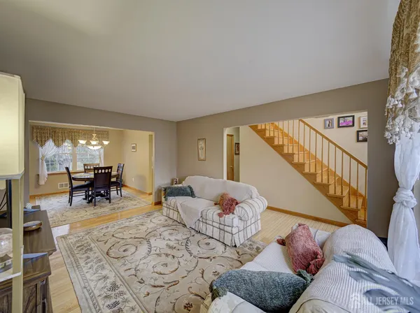 a living room with furniture and large windows