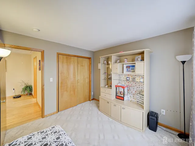 a bedroom with a bed and a view of bathroom