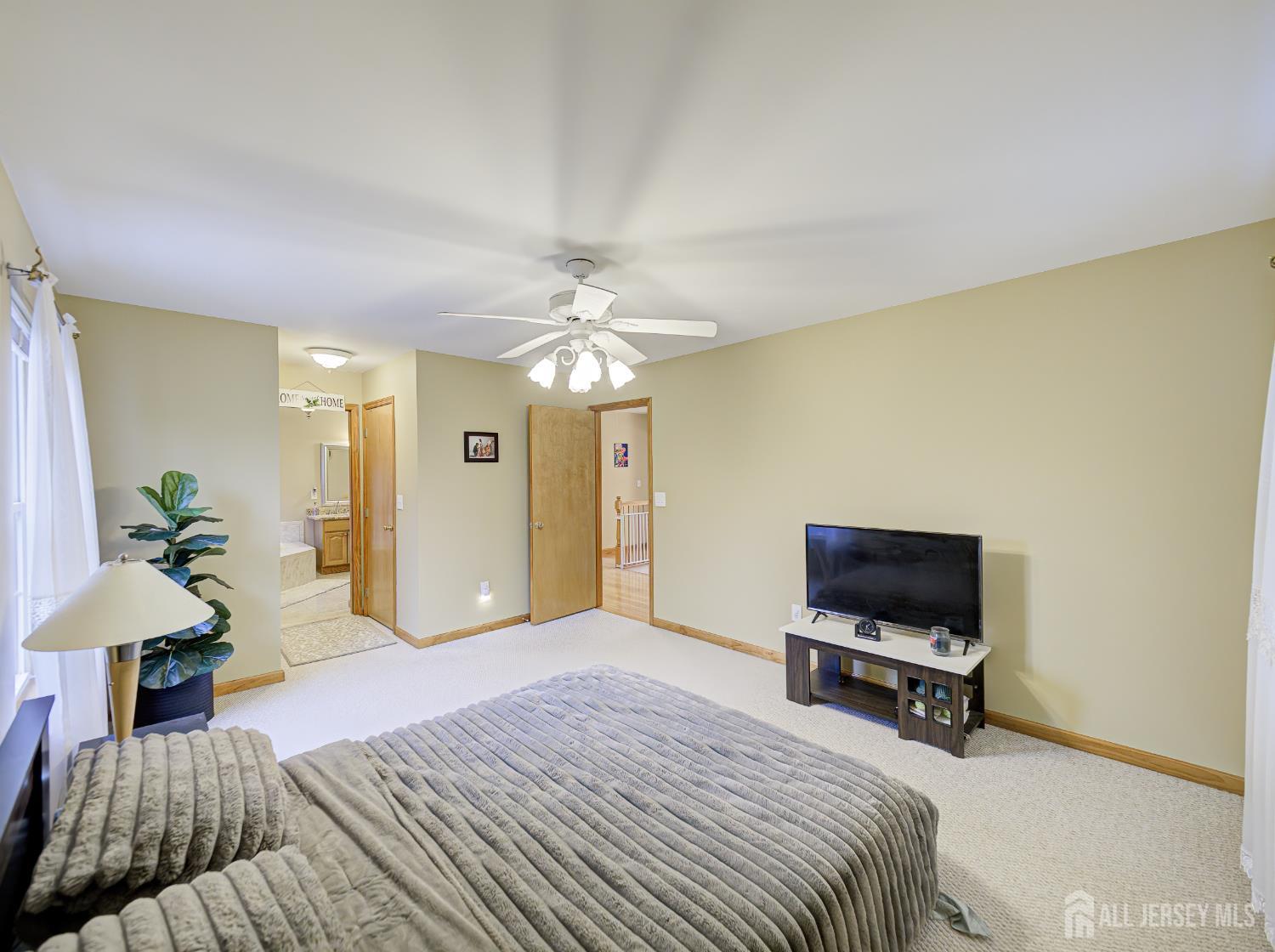 357 George Street South Amboy, NJ 08879 - Photo 30 of 36 a bedroom with a bed and a chandelier