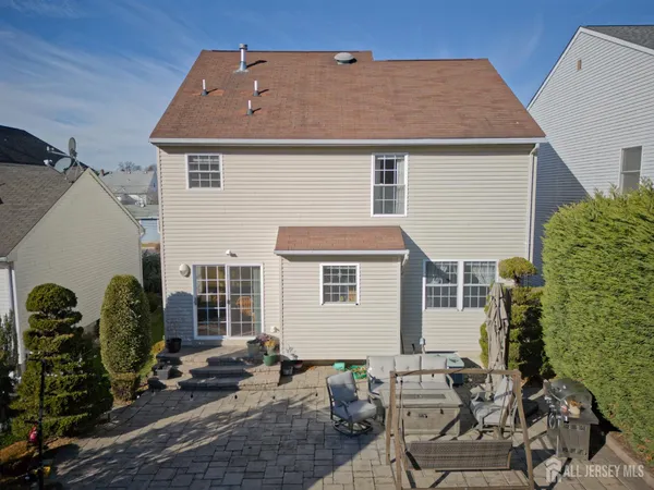 a front view of house with yard outdoor seating and barbeque oven