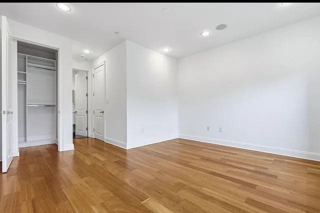 a bathroom with a shower a toilet and sink