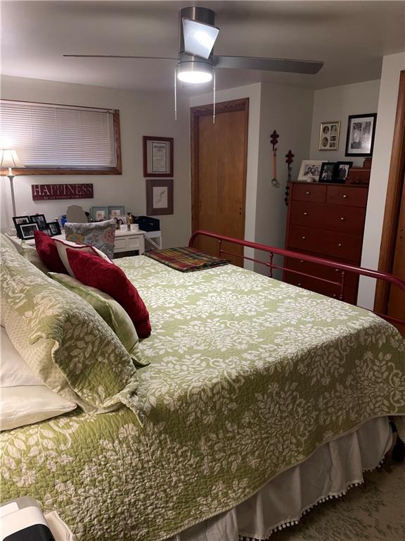 128 Lebanon Church Road Pittsburgh, PA 15236 - Photo 18 of 28 a bedroom with a bed and a mirror on dresser