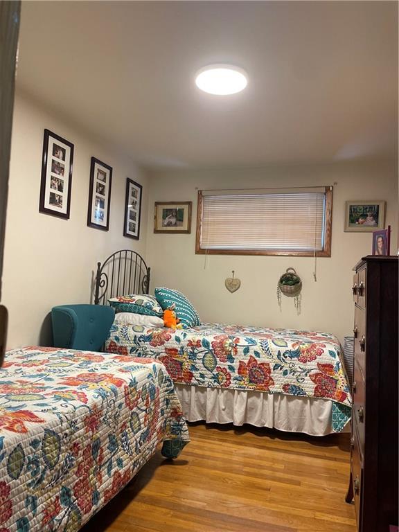 128 Lebanon Church Road Pittsburgh, PA 15236 - Photo 19 of 28 a bedroom with a bed and painting on the wall