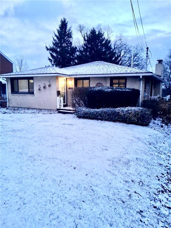 128 Lebanon Church Road Pittsburgh, PA 15236 - Photo 2 of 28 a front view of a house with a yard and garage