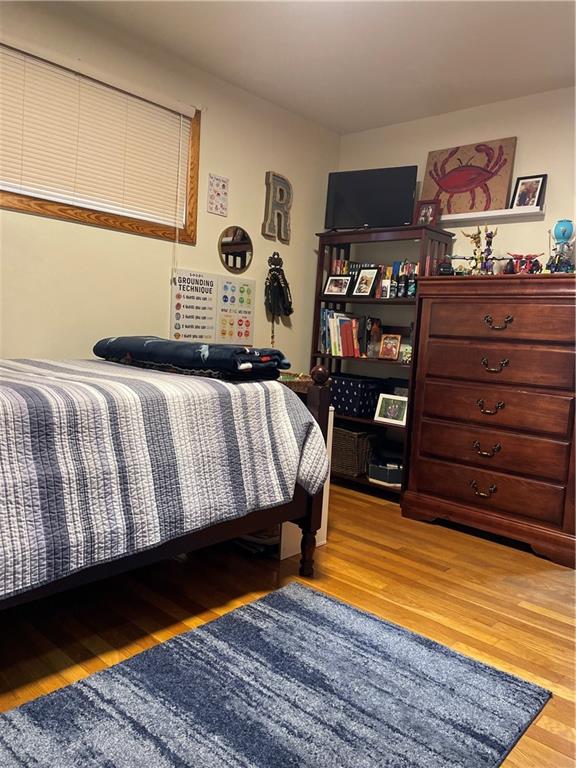 128 Lebanon Church Road Pittsburgh, PA 15236 - Photo 22 of 28 a bedroom with a bed and dresser