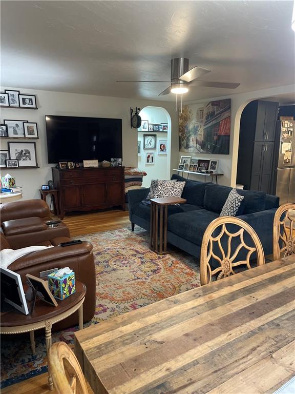 128 Lebanon Church Road Pittsburgh, PA 15236 - Photo 4 of 28 a living room with furniture a flat screen tv and kitchen view