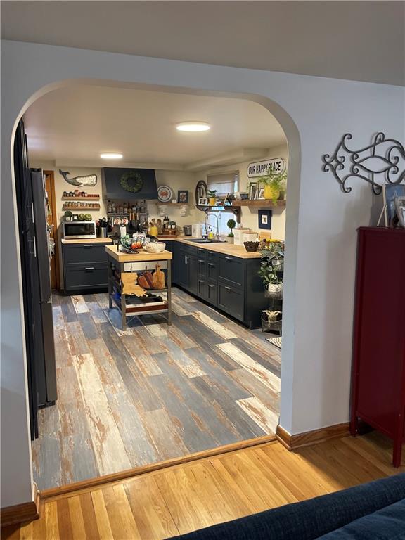 128 Lebanon Church Road Pittsburgh, PA 15236 - Photo 7 of 28 a kitchen with stainless steel appliances kitchen island granite countertop a refrigerator and a stove