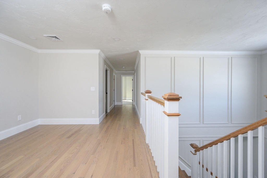 78 Metacomet Road, Unit 78 West Bridgewater, MA 02379 - Photo 24 of 39 a view of a hallway with wooden floor and staircase