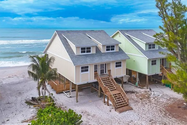a aerial view of a house with a yard
