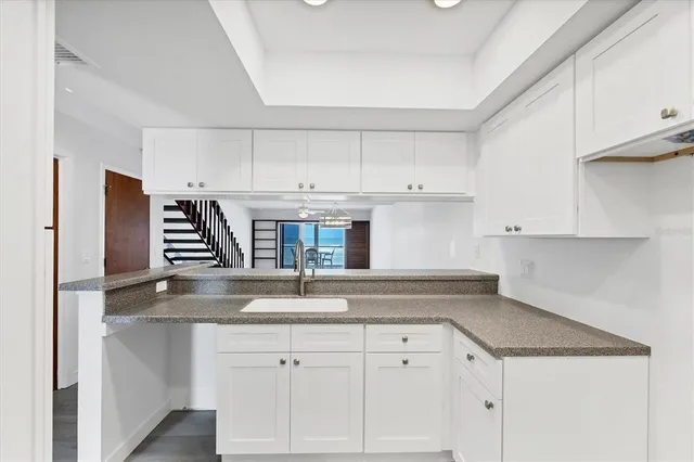 a bathroom with a sink toilet and a mirror