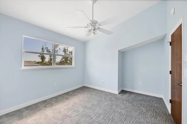 a view of a dining room with furniture wooden floor and chandelier