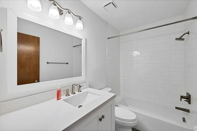 a view of outdoor space with wooden floor and windows