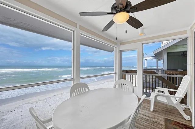 a view of a hallway with windows and stairs