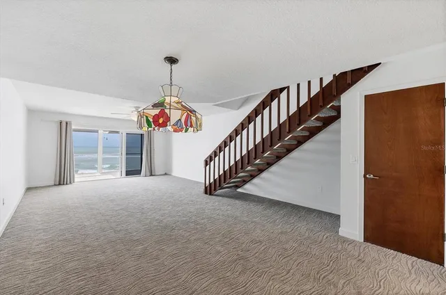 a kitchen with stainless steel appliances granite countertop a sink stove and white cabinets