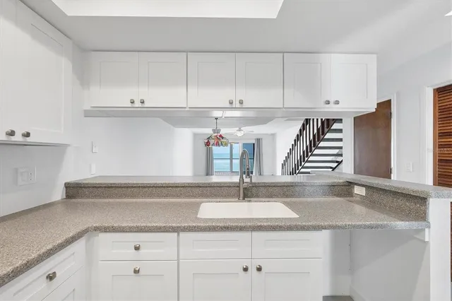 a view of a balcony with wooden floor and fence