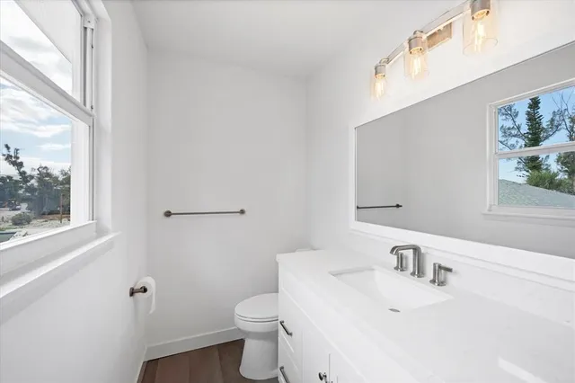 a view of a balcony with wooden floor and fence