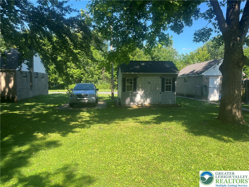 1839 Willow Park Road Bethlehem, PA 18020 - Photo 32 of 35 A verdant backyard with practical storage solutions and ample space.