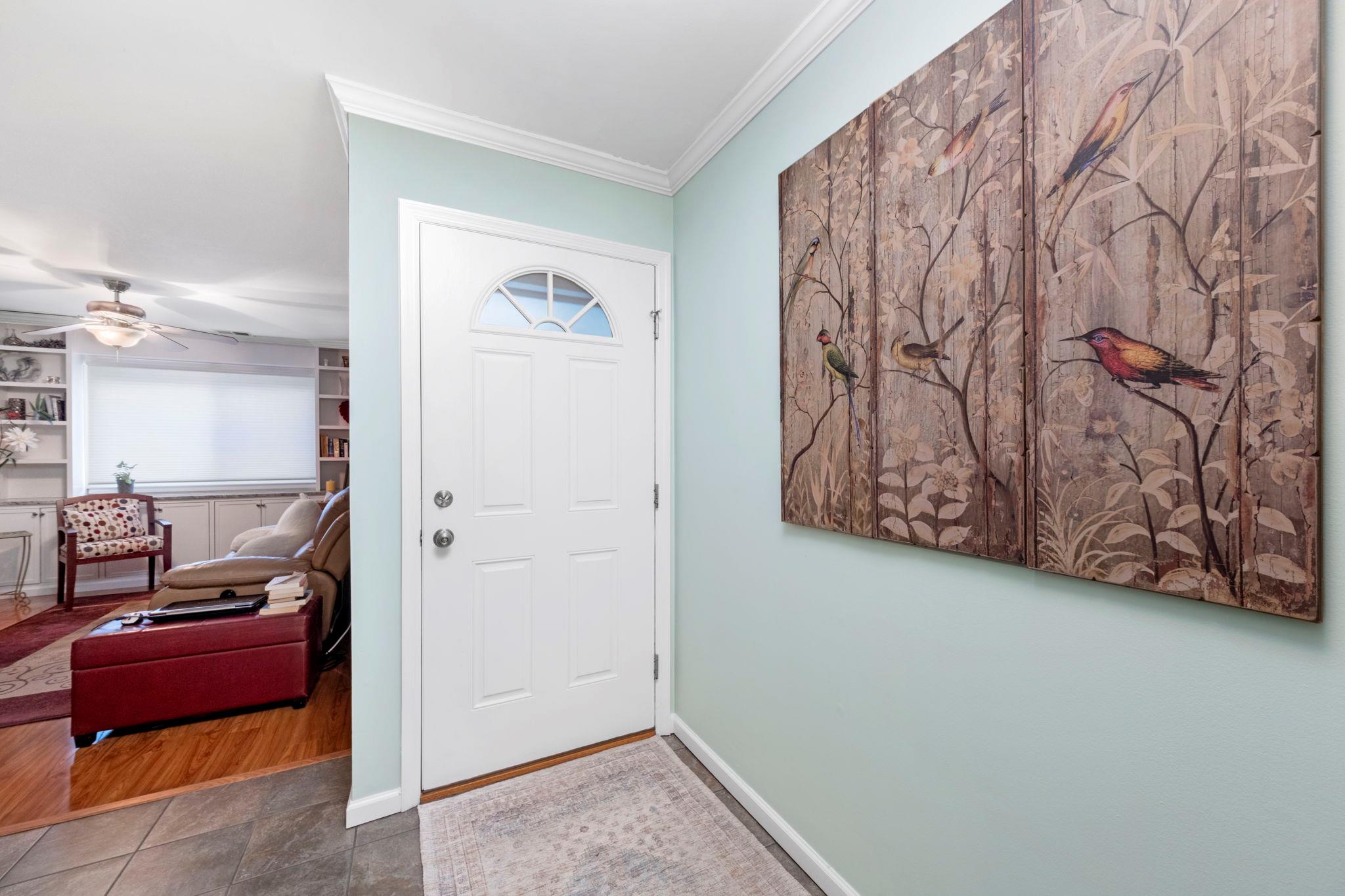 7 Knightsbridge, Unit J Poughkeepsie, NY 12603 - Photo 1 of 1 Foyer with tile patterned flooring, ornamental molding, baseboards, and ceiling fan