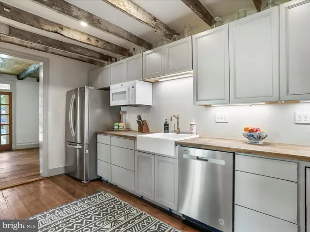 a kitchen with a stove and a refrigerator