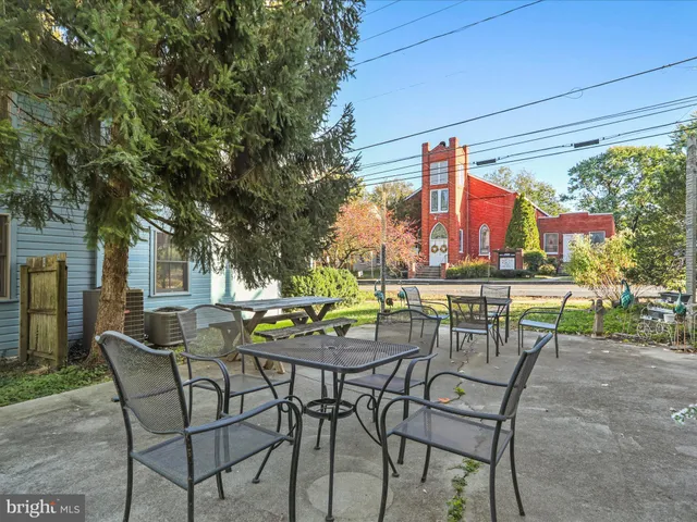 a bedroom with a bed and a fireplace
