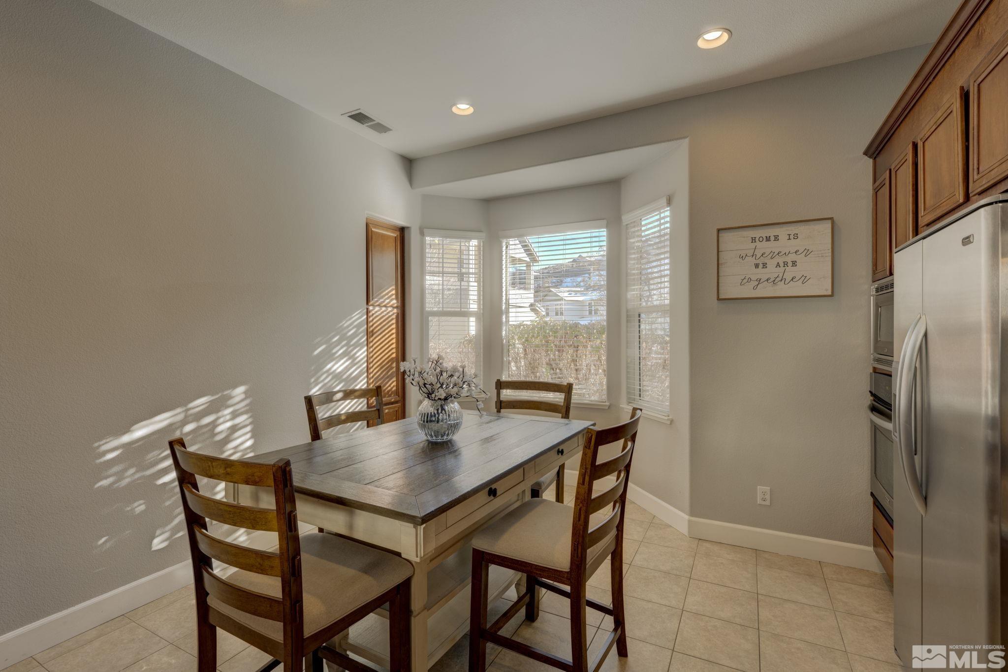 7669 Stone Bluff Way Reno, NV 89523 - Photo 11 of 40 a dining room with furniture and window