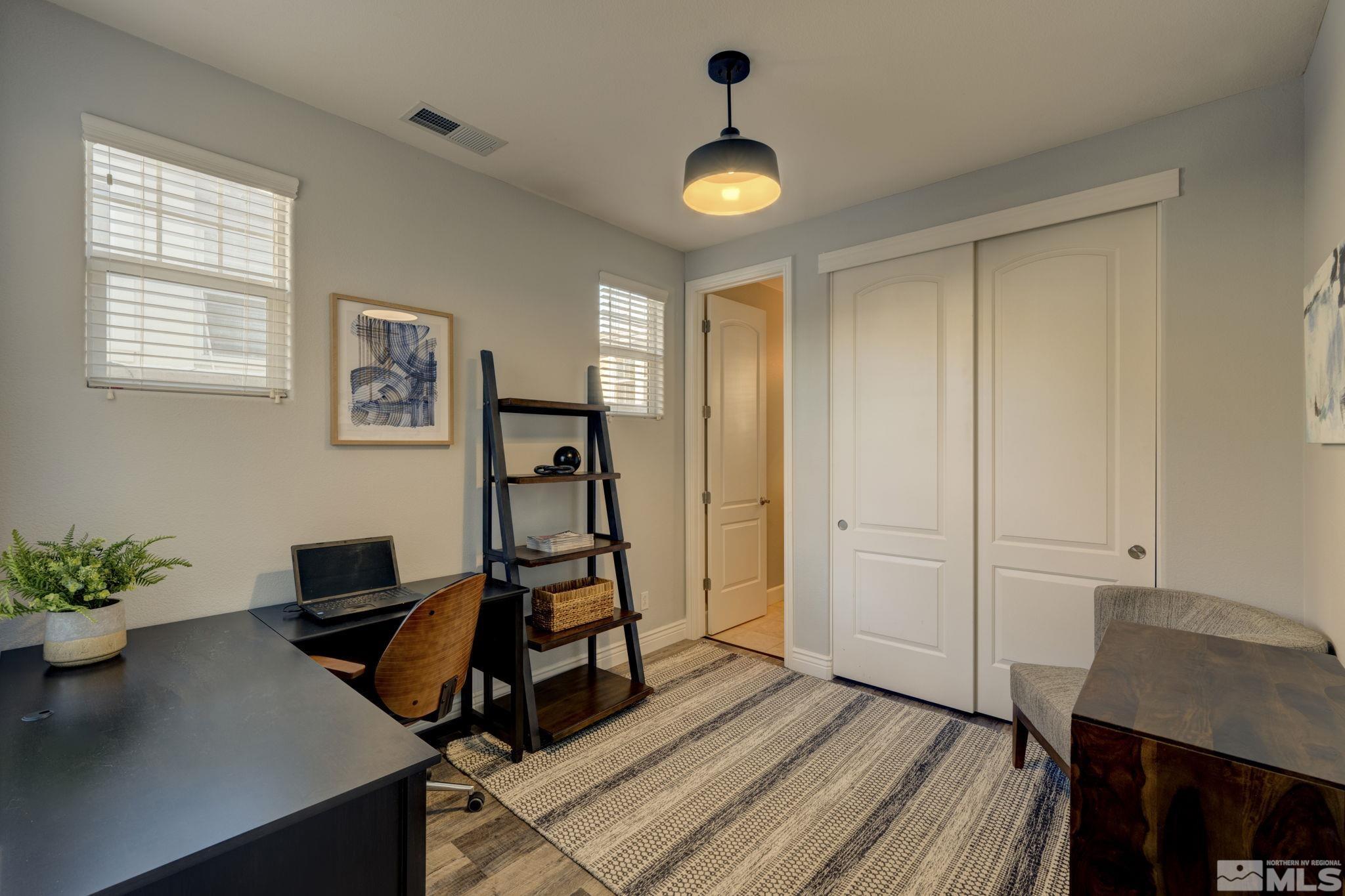 7669 Stone Bluff Way Reno, NV 89523 - Photo 14 of 40 a view of a workspace with furniture and a window