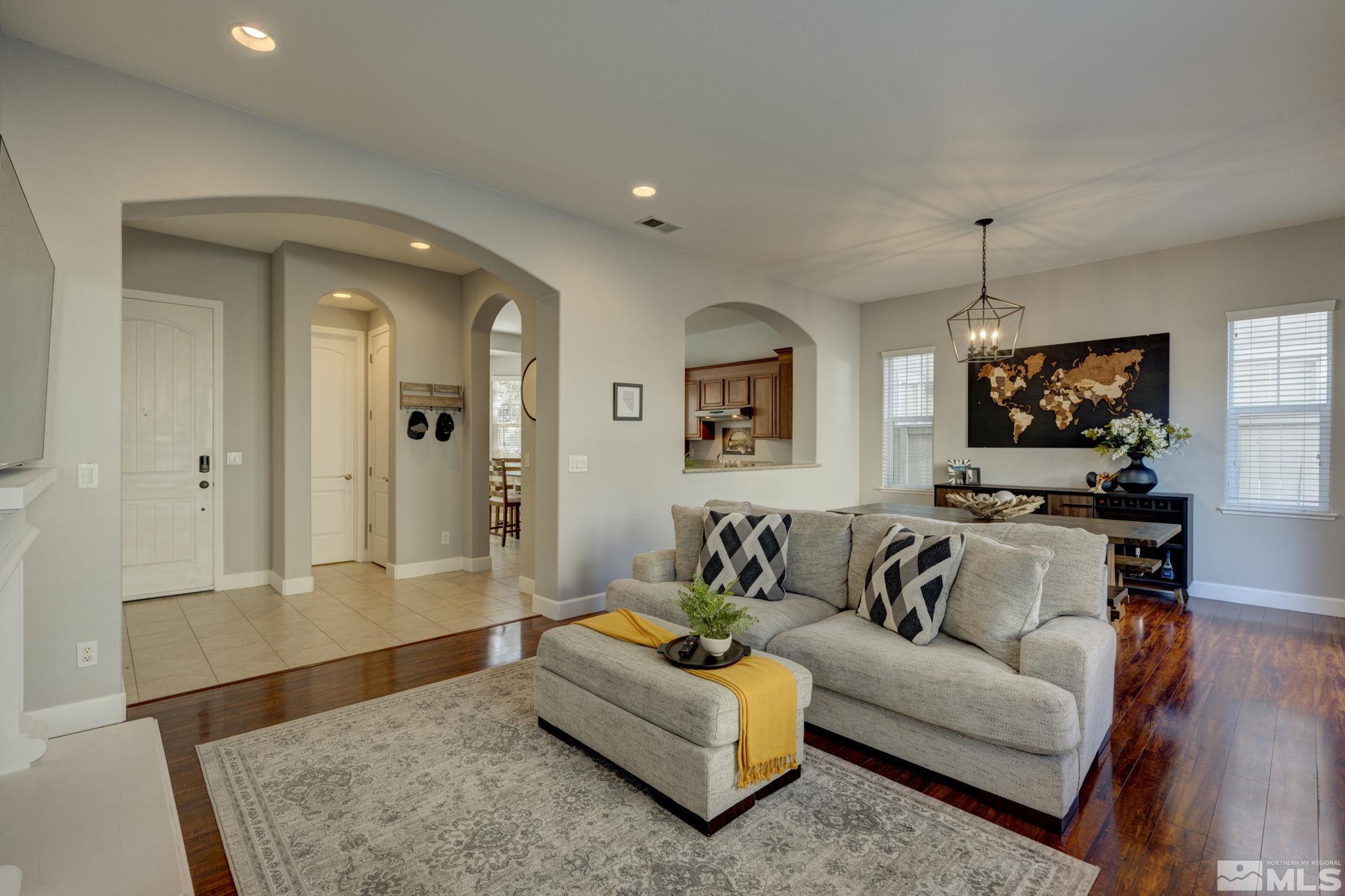 7669 Stone Bluff Way Reno, NV 89523 - Photo 3 of 40 a living room with furniture and a flat screen tv