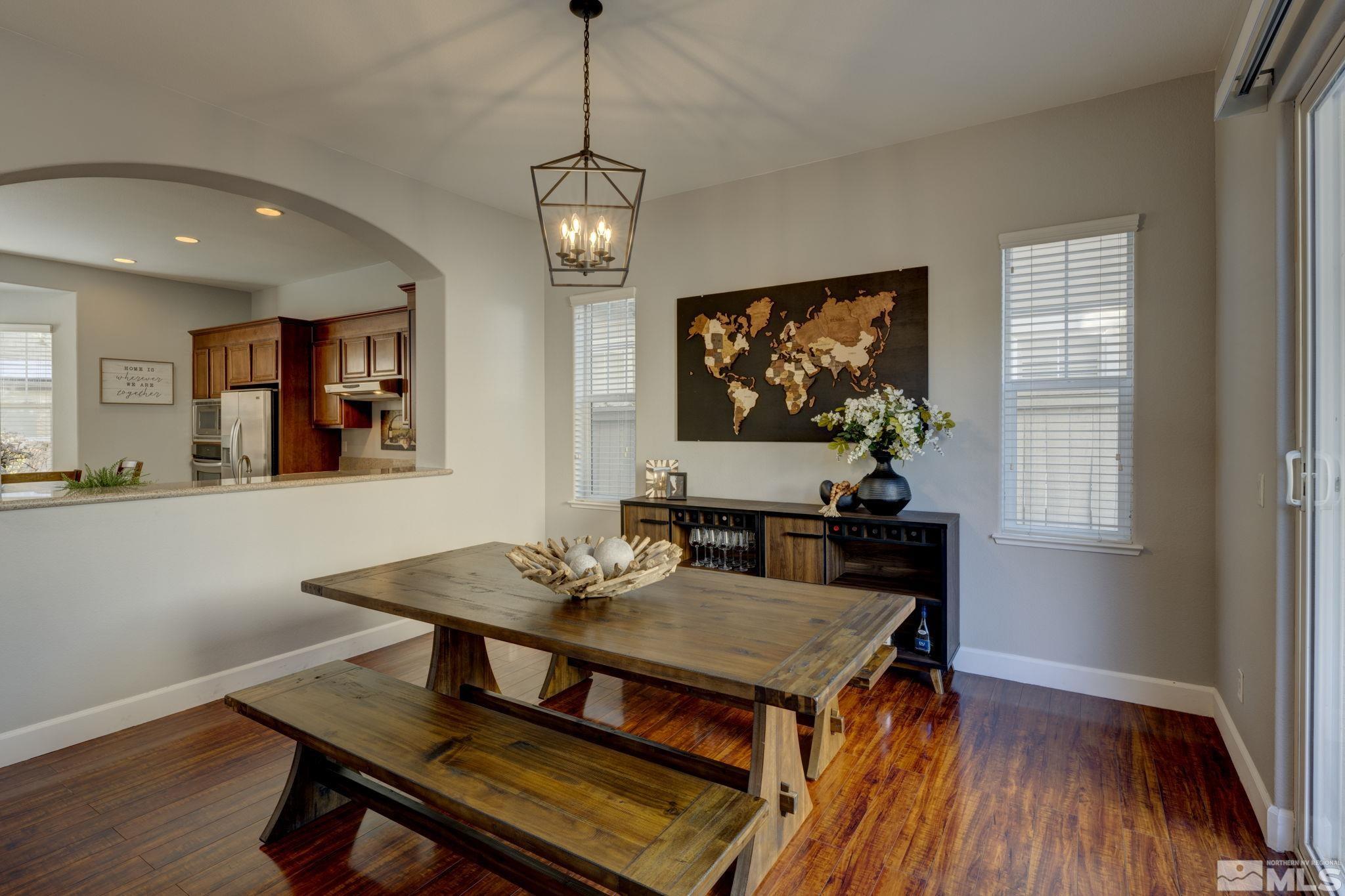 7669 Stone Bluff Way Reno, NV 89523 - Photo 8 of 40 a view of a dining room with furniture window and wooden floor