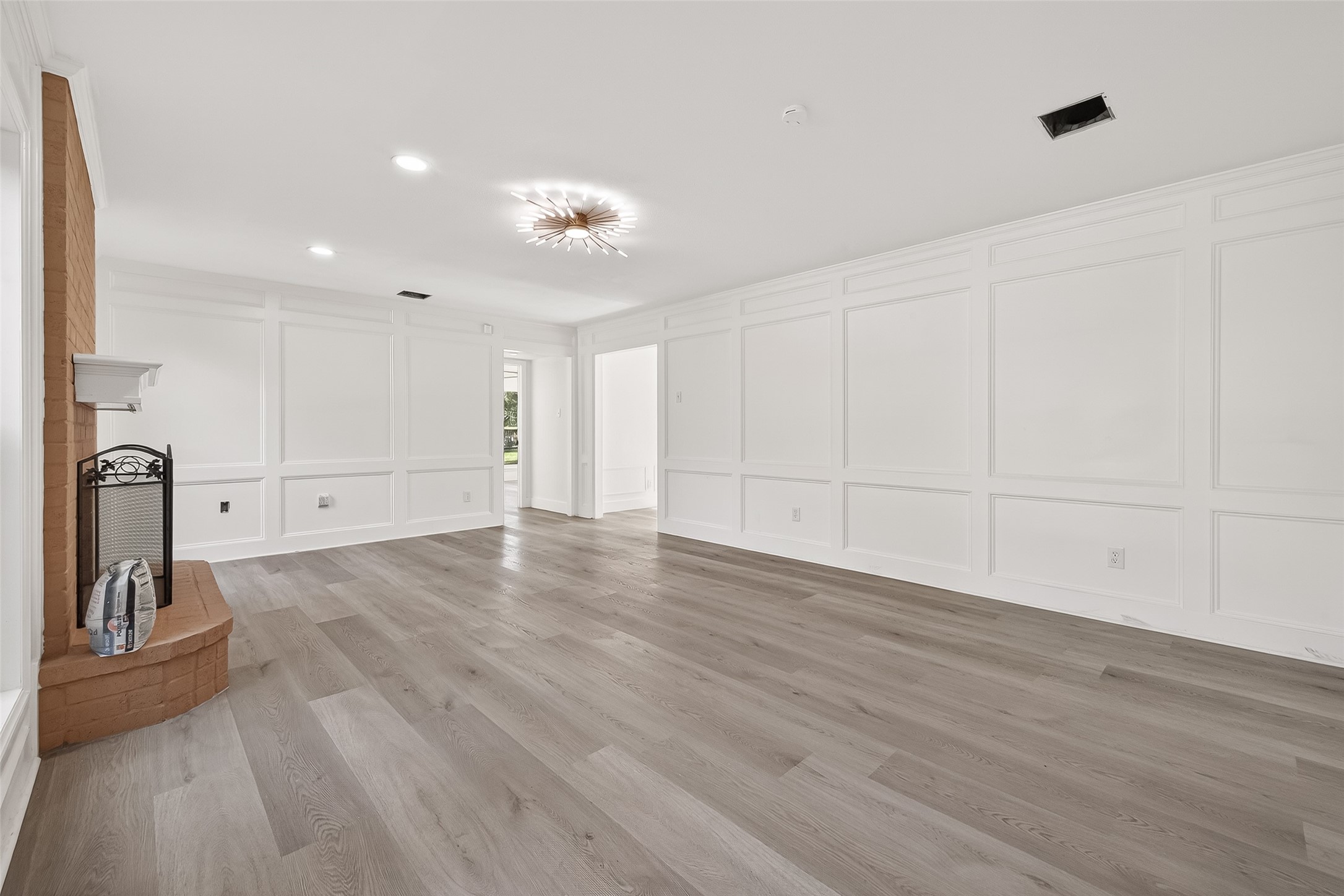 6210 Rippling Hollow Drive Spring, TX 77379 - Photo 18 of 50 a view of a room with wooden floor and a ceiling fan