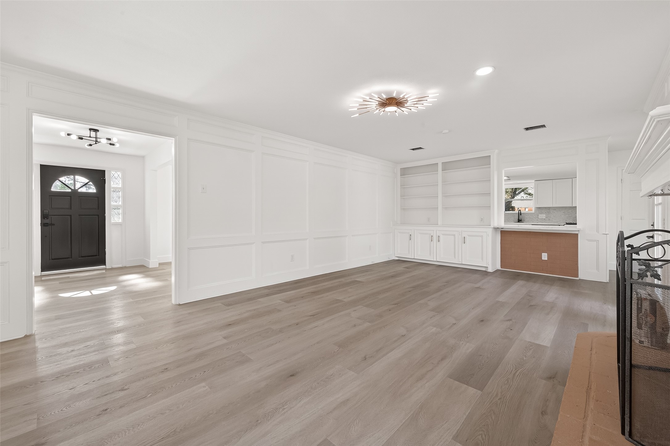 6210 Rippling Hollow Drive Spring, TX 77379 - Photo 21 of 50 a view of an empty room with wooden floor and cabinet