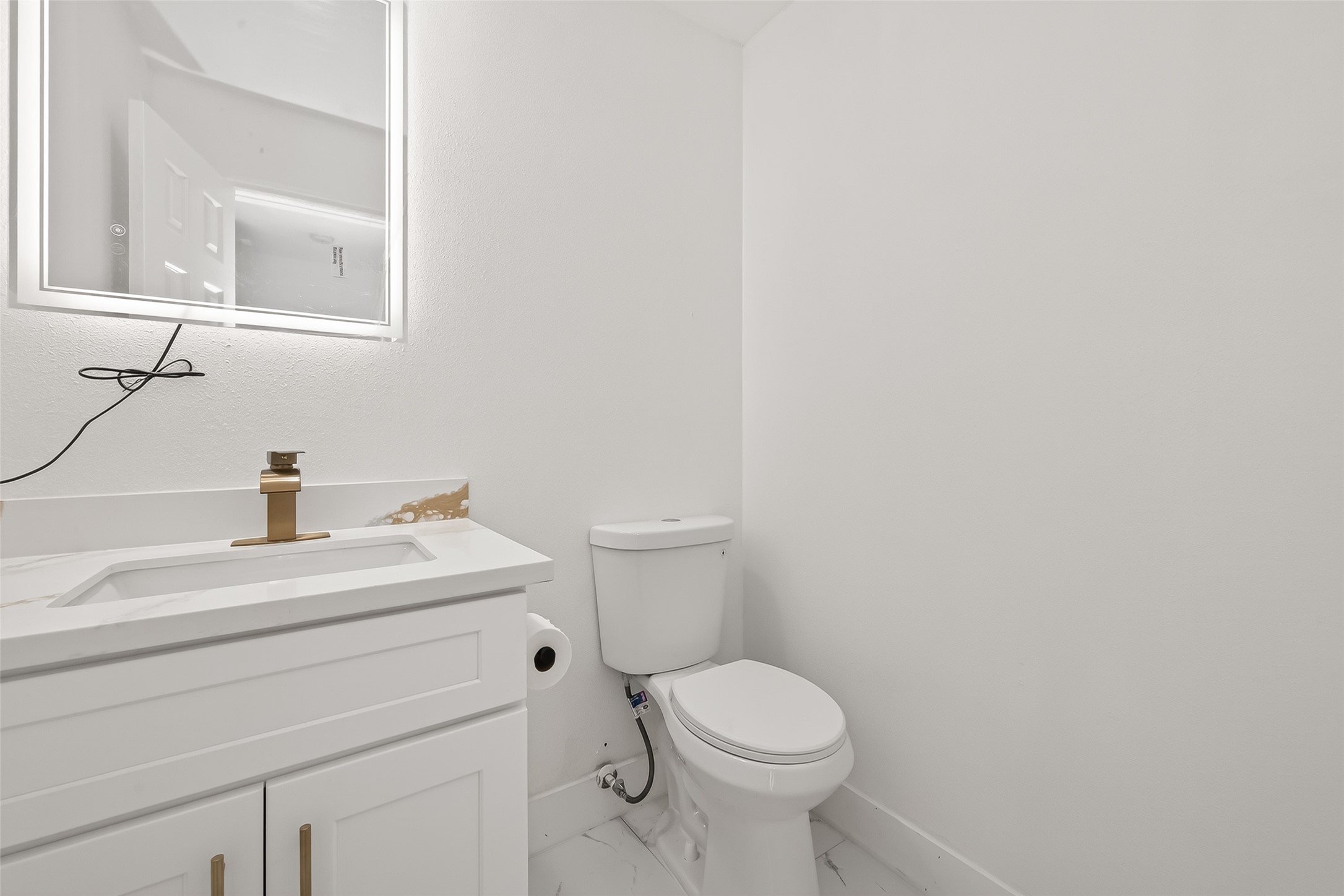 6210 Rippling Hollow Drive Spring, TX 77379 - Photo 22 of 50 a bathroom with a toilet a sink and mirror