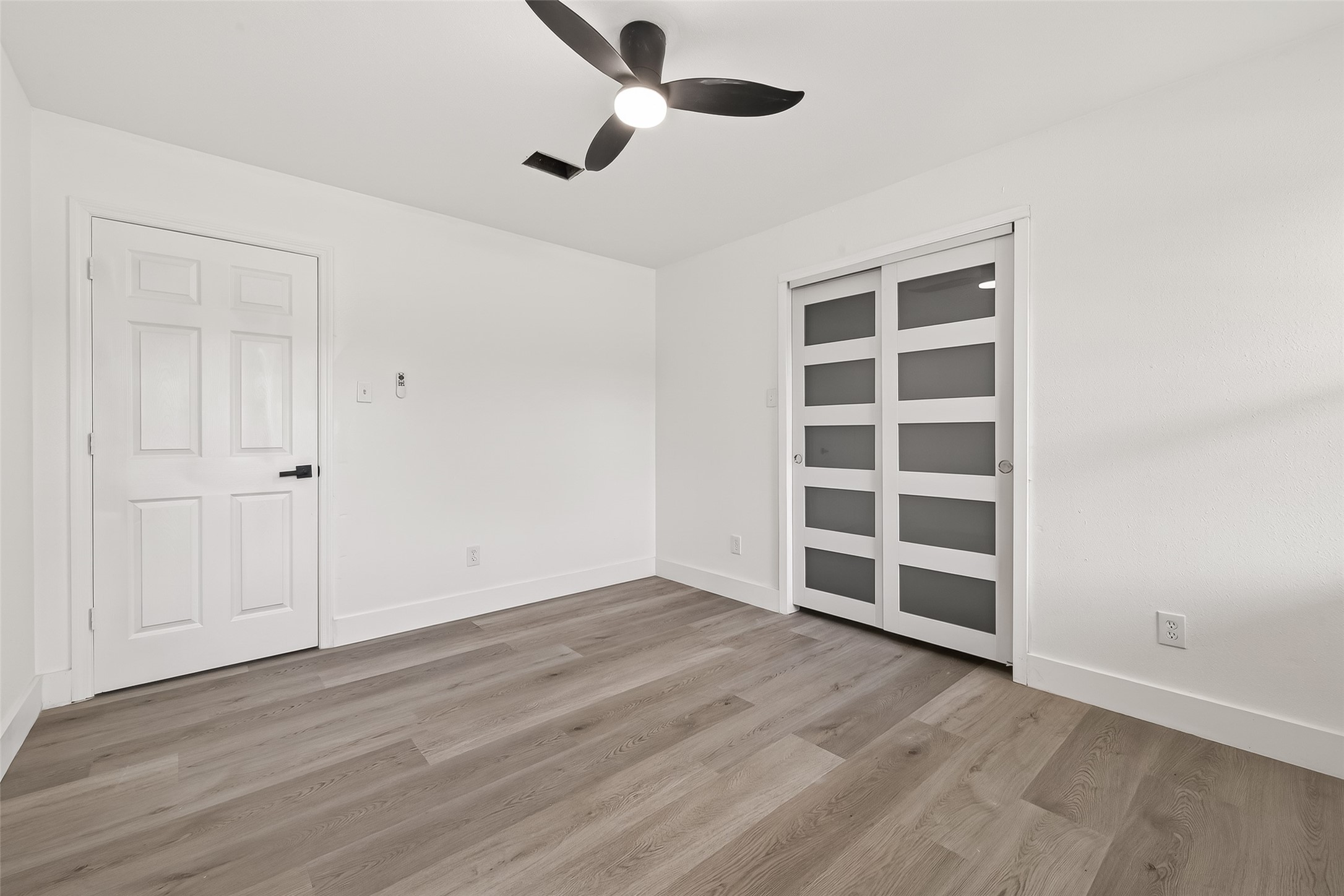 6210 Rippling Hollow Drive Spring, TX 77379 - Photo 31 of 50 a view of an empty room with wooden floor closet and windows