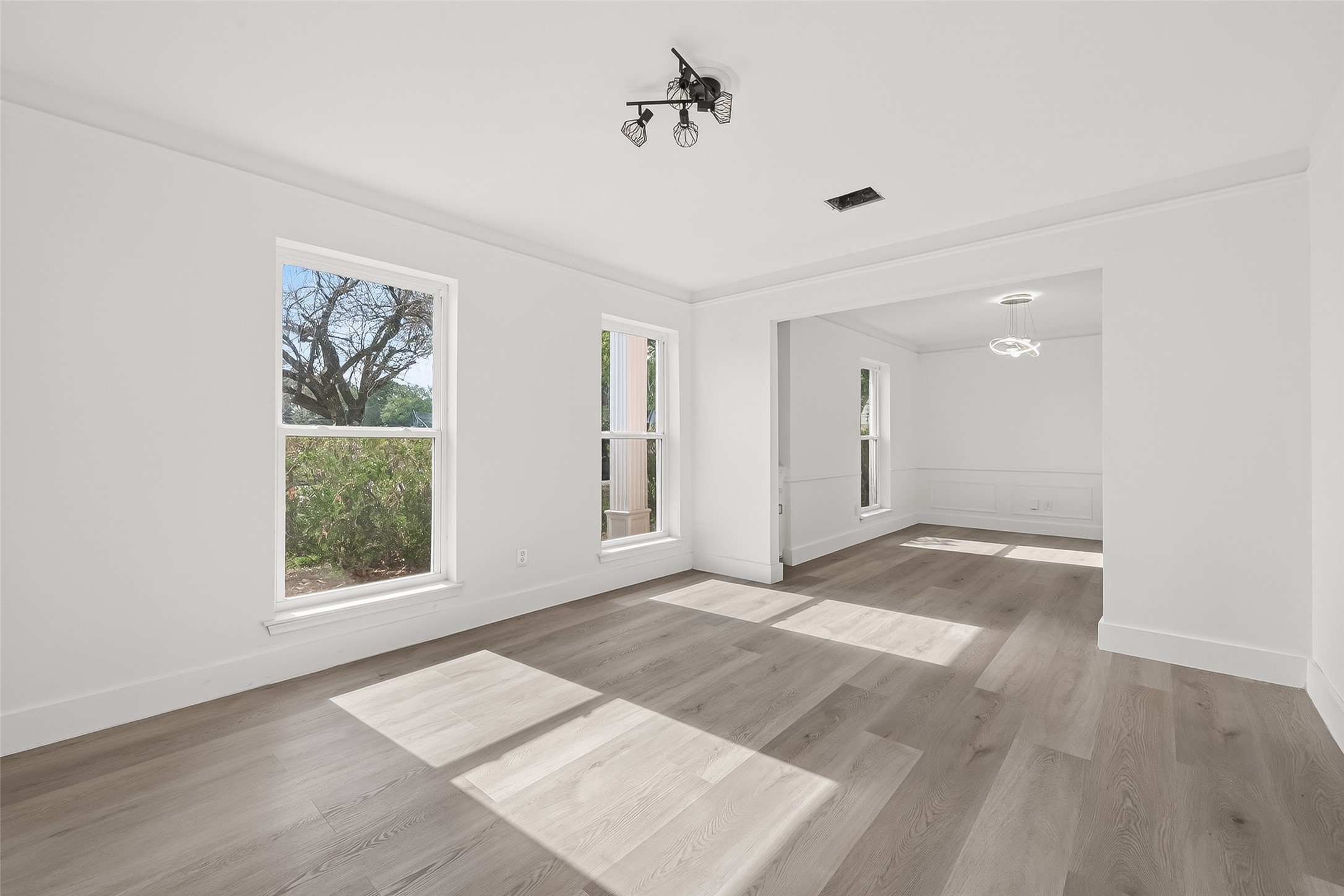 6210 Rippling Hollow Drive Spring, TX 77379 - Photo 48 of 50 a view of an empty room with wooden floor and a window