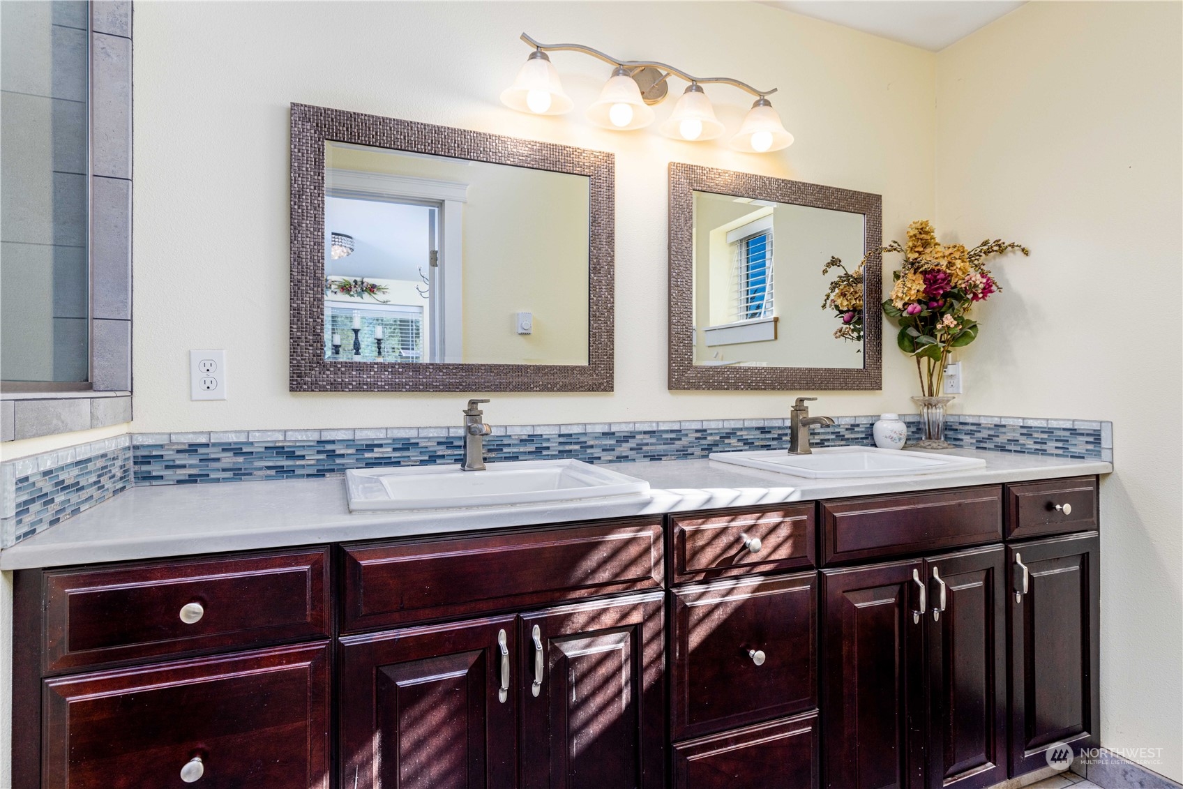 142 Literal Road Chehalis, WA 98532 - Photo 13 of 40 a bathroom with a granite countertop sink a mirror and wooden cabinets