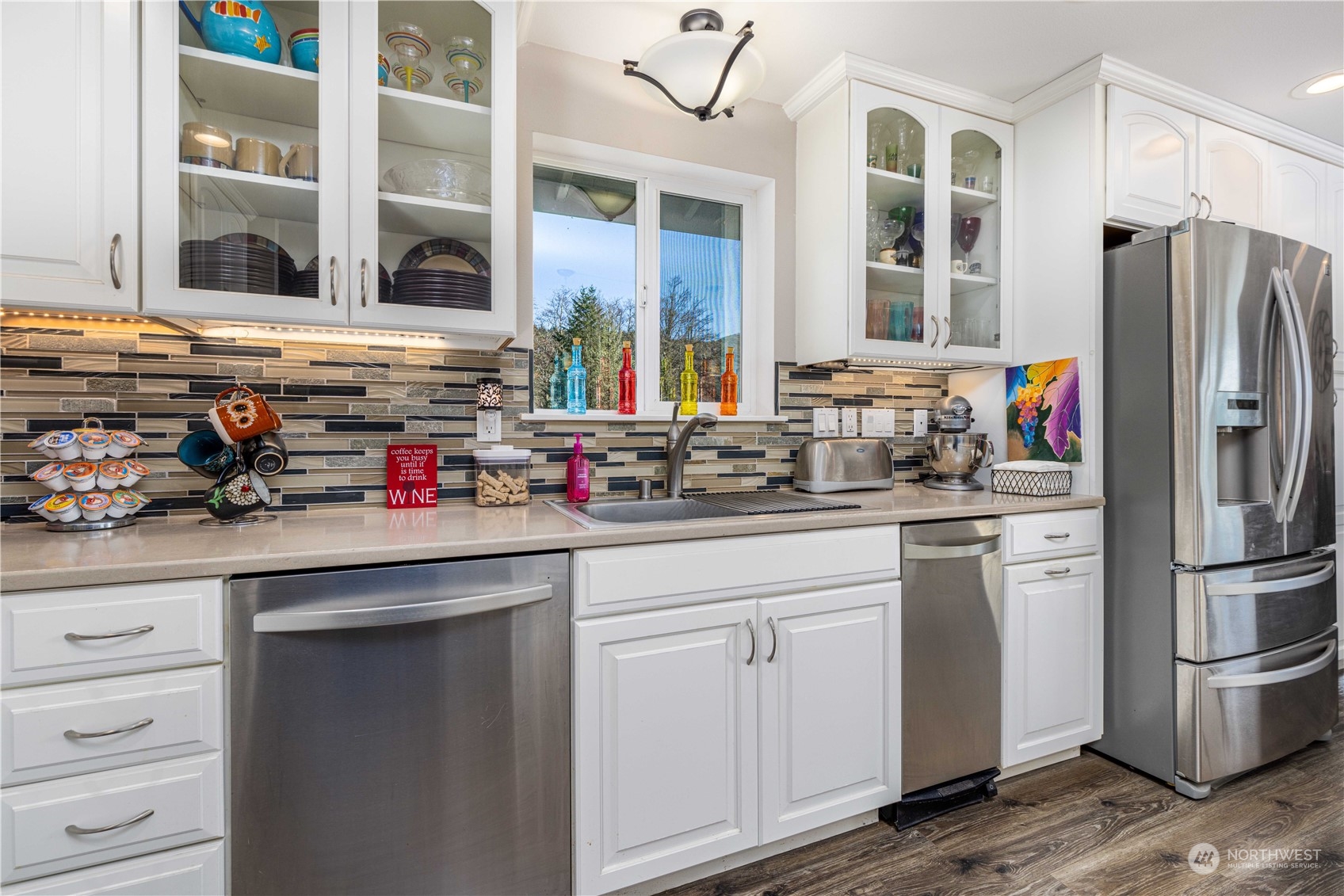 142 Literal Road Chehalis, WA 98532 - Photo 22 of 40 a kitchen with stainless steel appliances granite countertop a refrigerator and cabinets