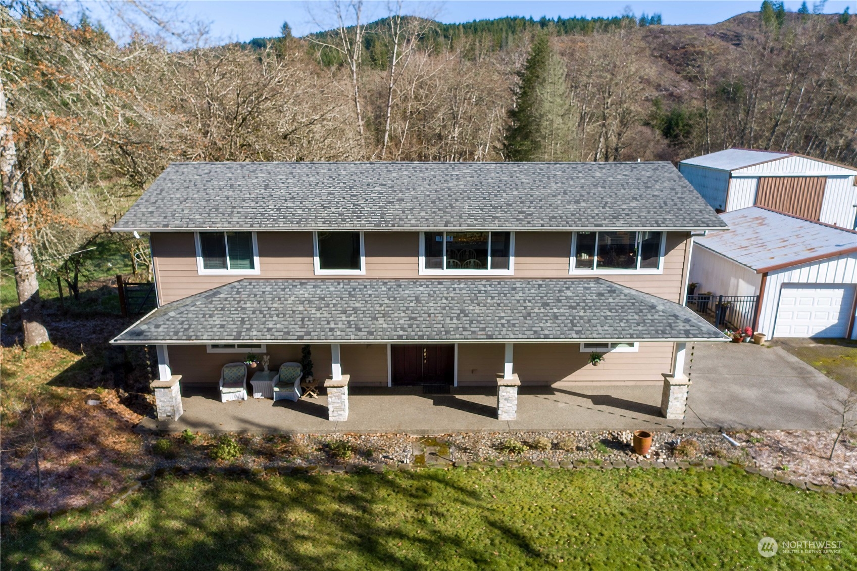 142 Literal Road Chehalis, WA 98532 - Photo 6 of 40 a front view of house with yard and trees in the background