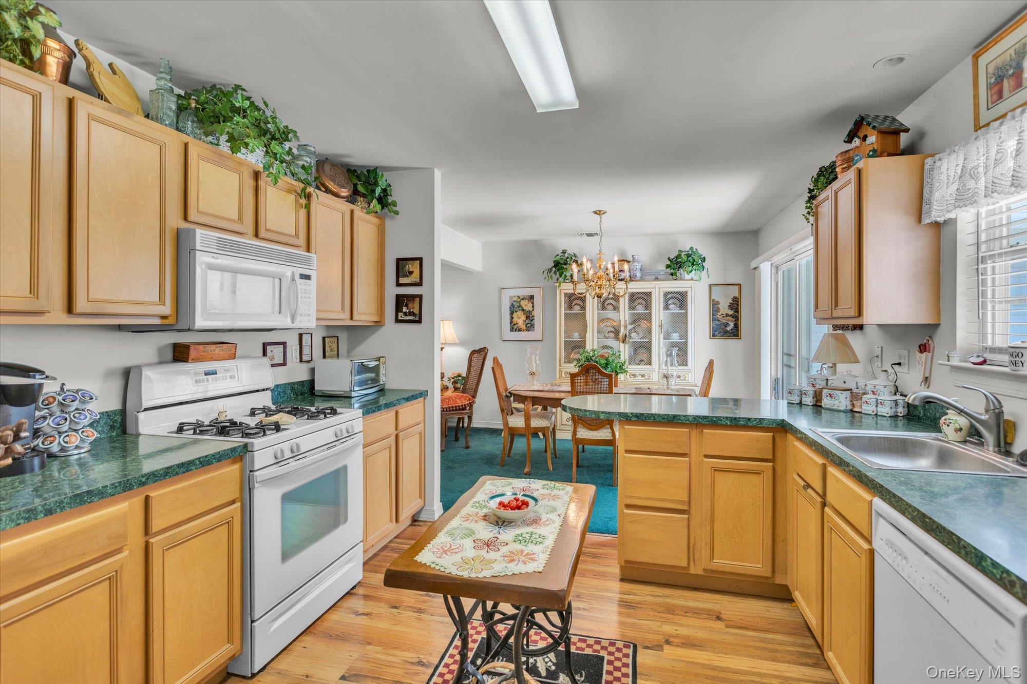 702 Pebble Beach Path Riverhead, NY 11901 - Photo 5 of 17 Kitchen with access to dining room.