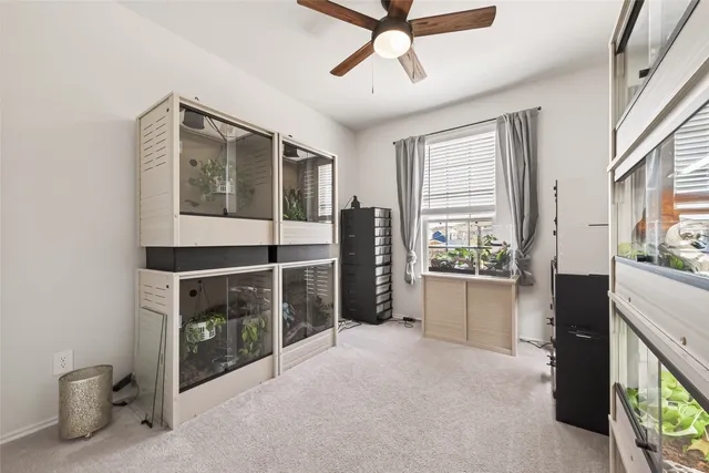 a kitchen with stainless steel appliances kitchen island granite countertop a refrigerator and a sink