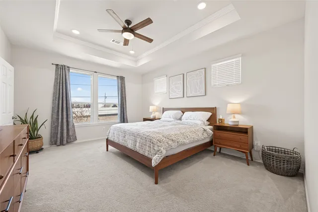 a bedroom with a bed and a couch