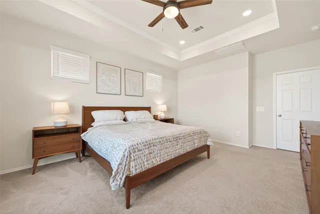 a bedroom with bed and window