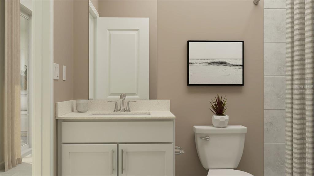 1660 Rider Rain Lane Apopka, FL 32703 - Photo 11 of 29 a bathroom with a toilet sink and mirror