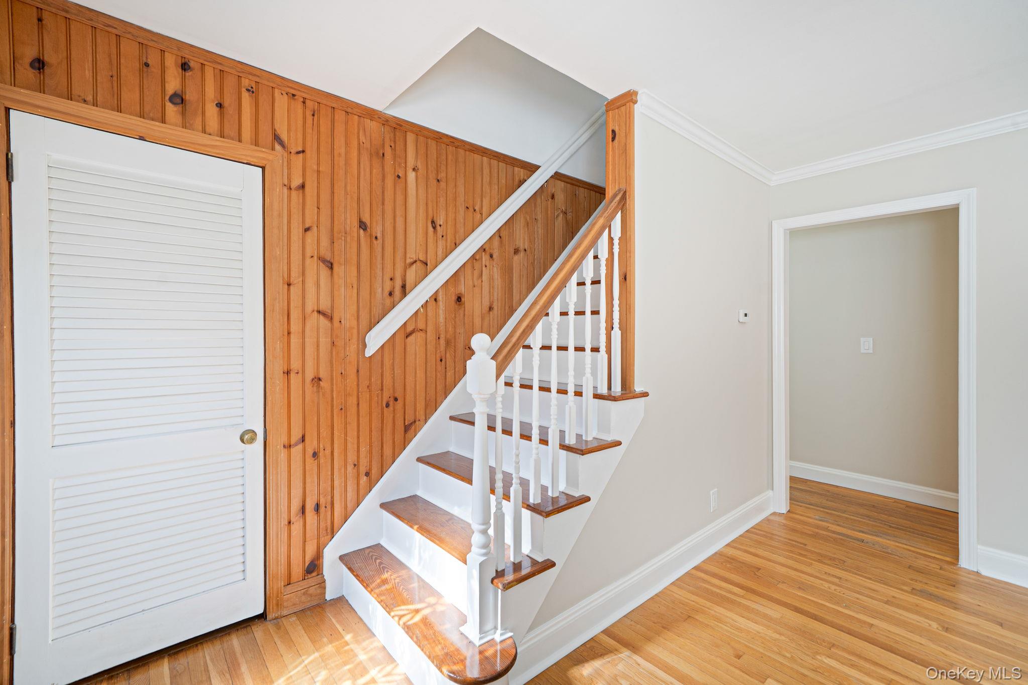 16 Valentine Road Shoreham, NY 11786 - Photo 18 of 41 Staircase to second level, coat closet in entry