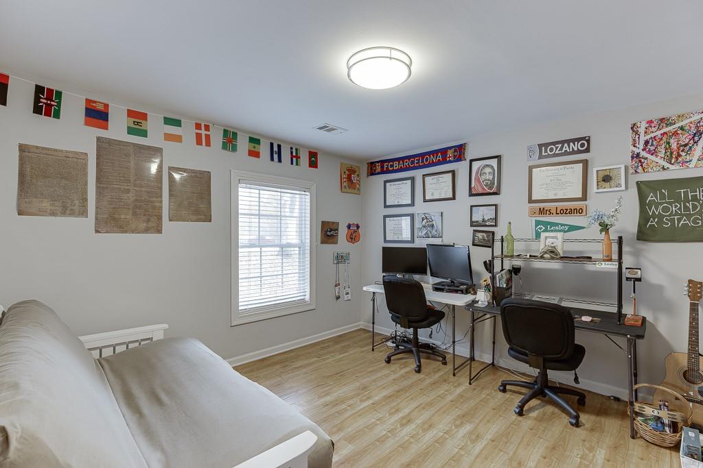2838 North Bogan Road Northeast Buford, GA 30519 - Photo 22 of 39 a view of a workspace with furniture and a window