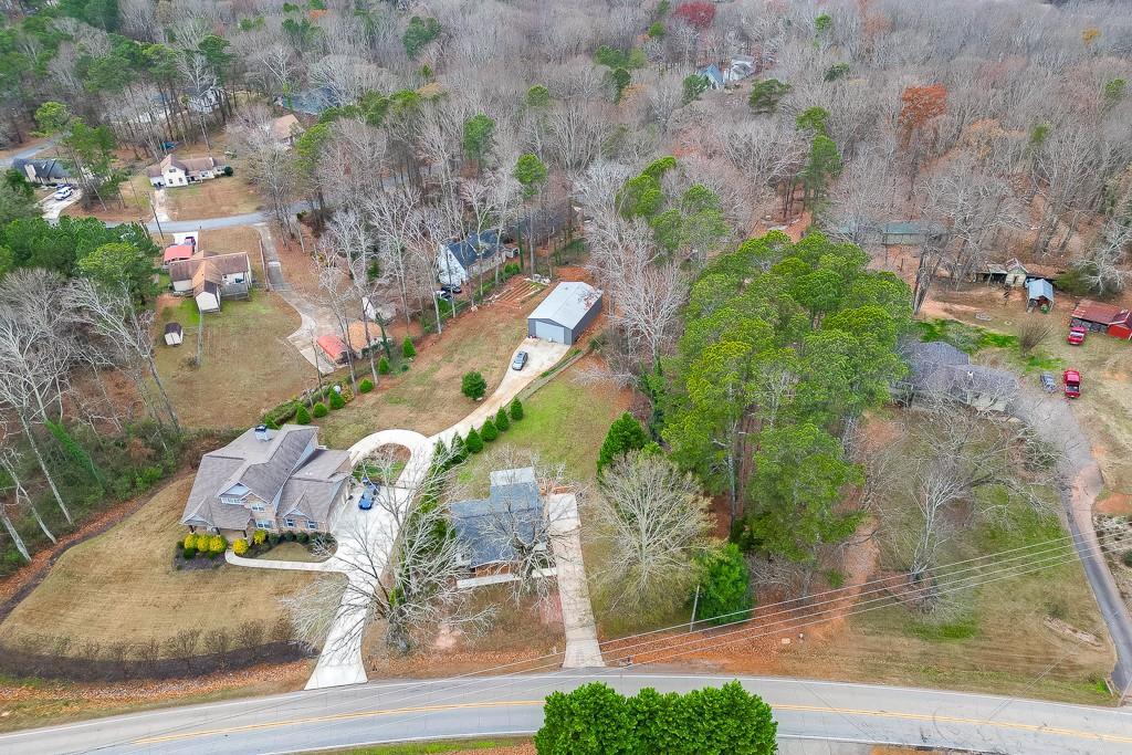 2838 North Bogan Road Northeast Buford, GA 30519 - Photo 36 of 39 an aerial view of a house with a yard and garage