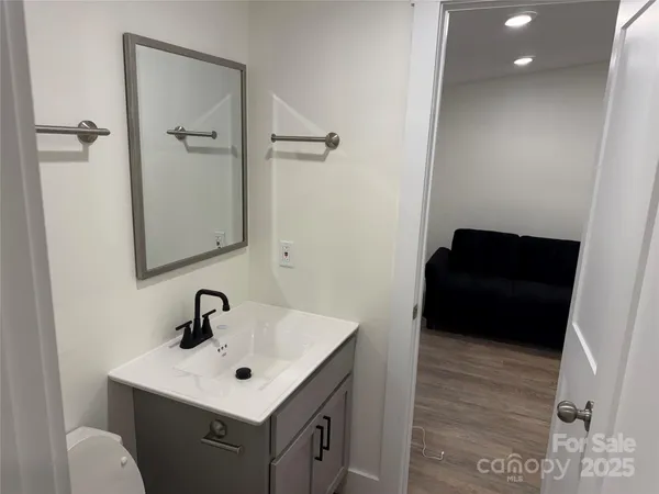 a bathroom with a sink and mirror